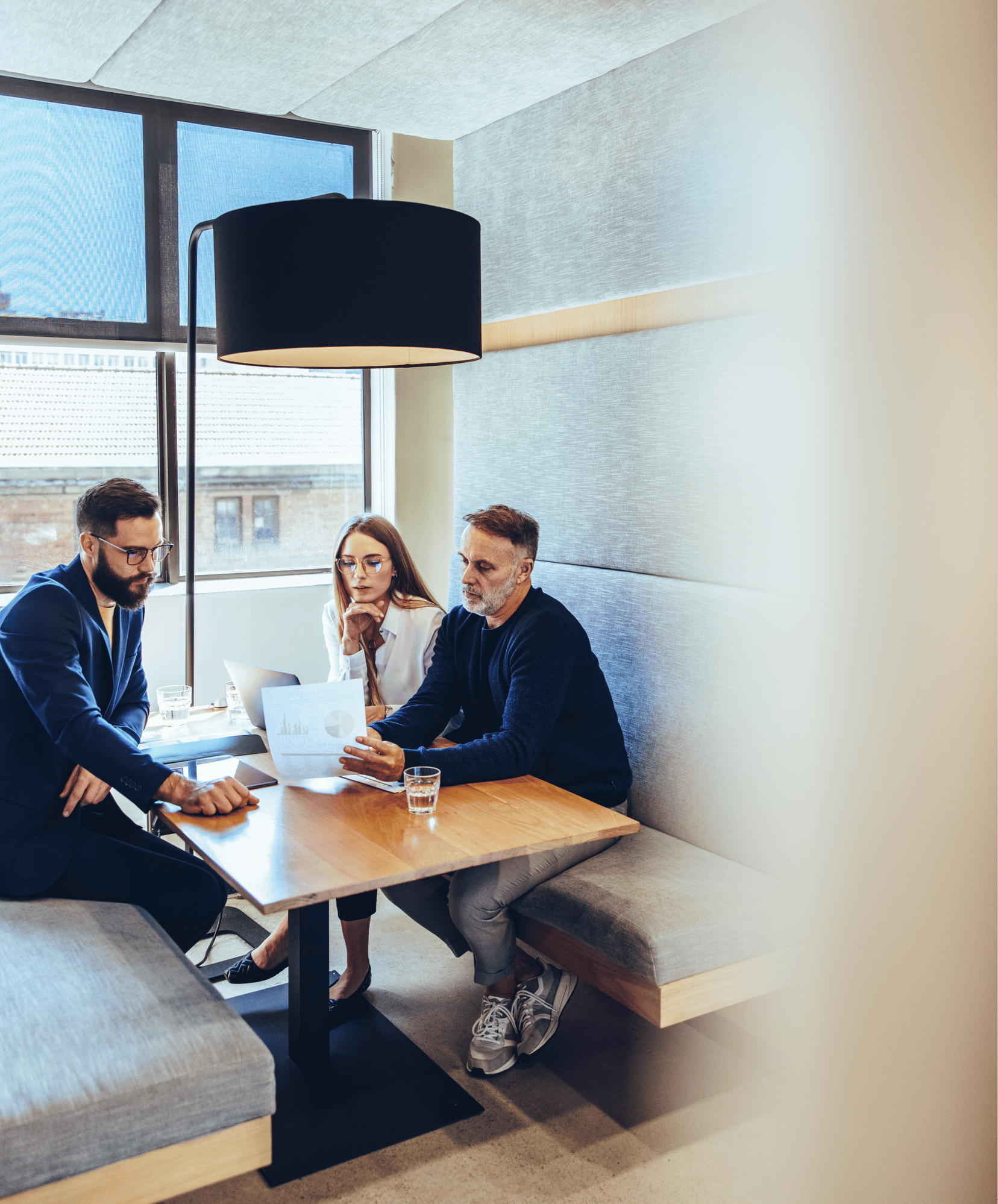 people sitting at a table with wall in foreground (1)-1-1